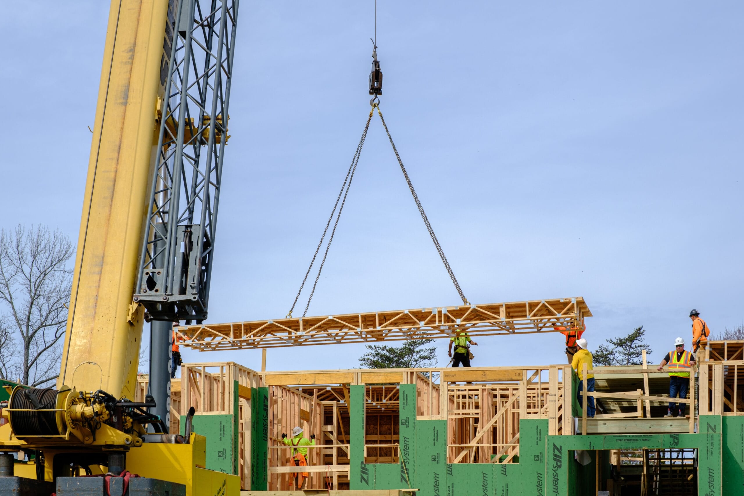 Floor cassette installation using crane at job site